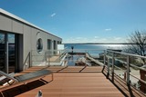 Ferienwohnung in Eckernförde - Apartmenthaus Hafenspitze Ap. 37 "Sonnendeck", Blickrichtung von der Terrasse auf das Offenes Meer, Strand, Innenstadt - Bild 1